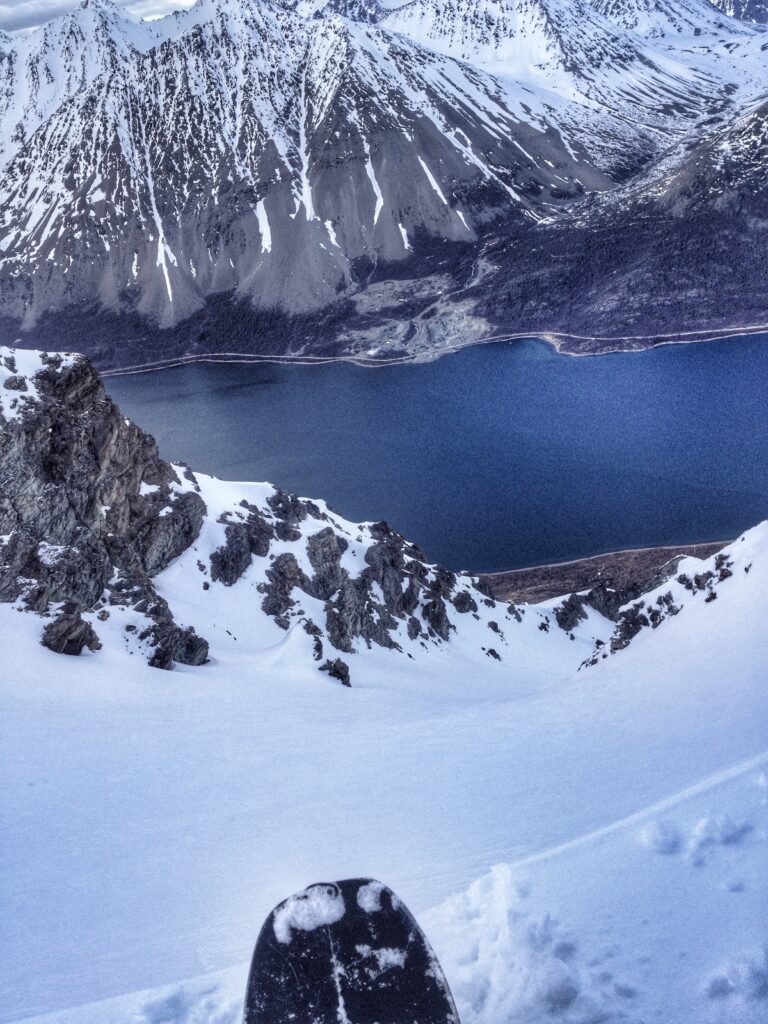 Looking down the north couloir of Store Fornestinden before snowboarding it