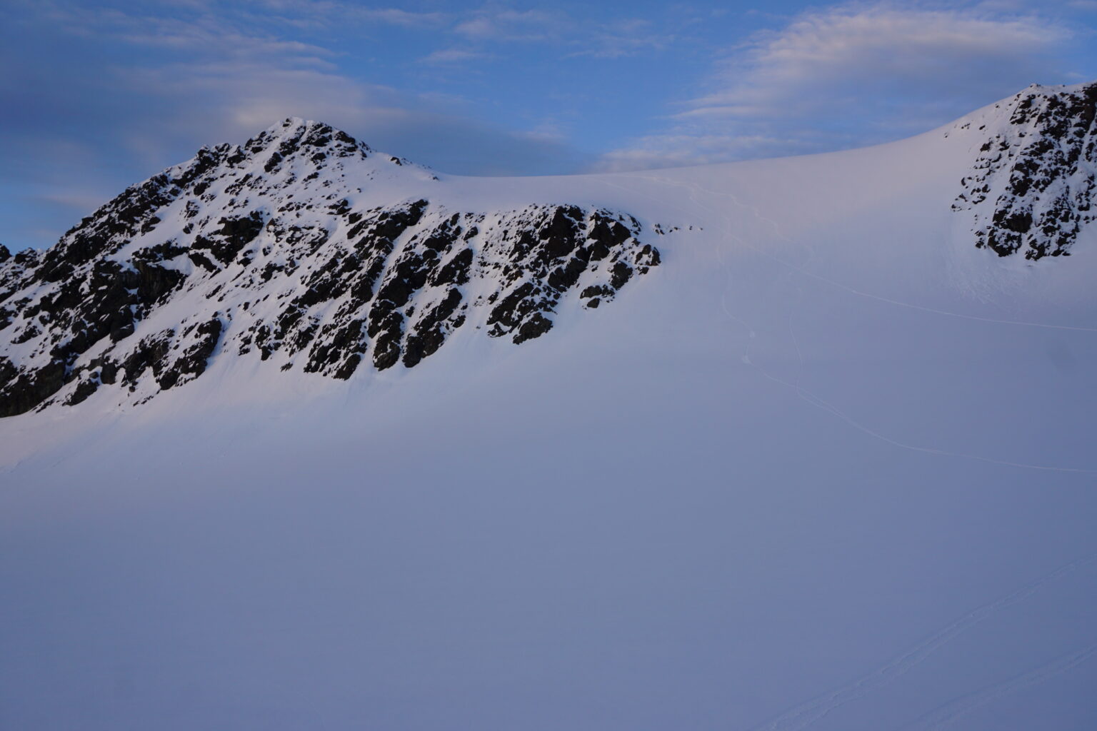 Looking at our snowboard tracks off Strupbeen Glacier