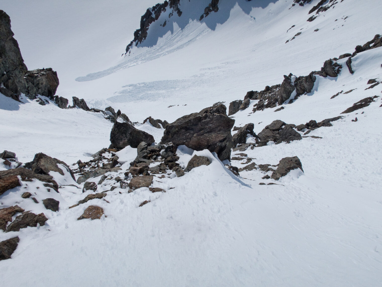 Preparing to snowboard off the north side of Strupbeen Glacier towards Tvillingtinden