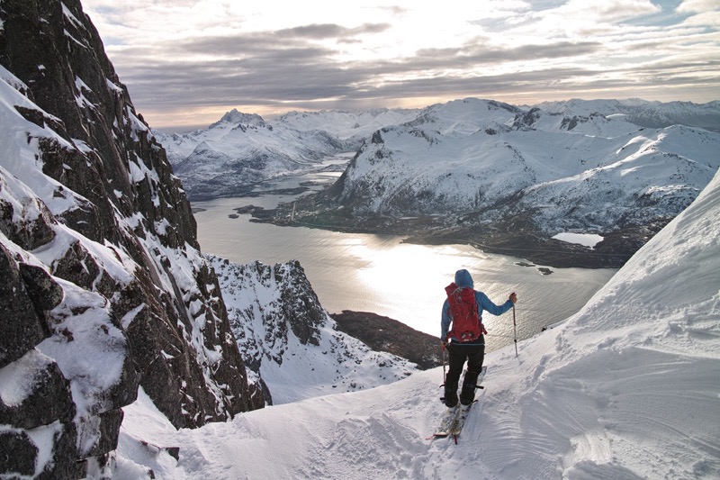 Enjoying a stunning view while ski touring in the Lofoten Islands of Northern Norway