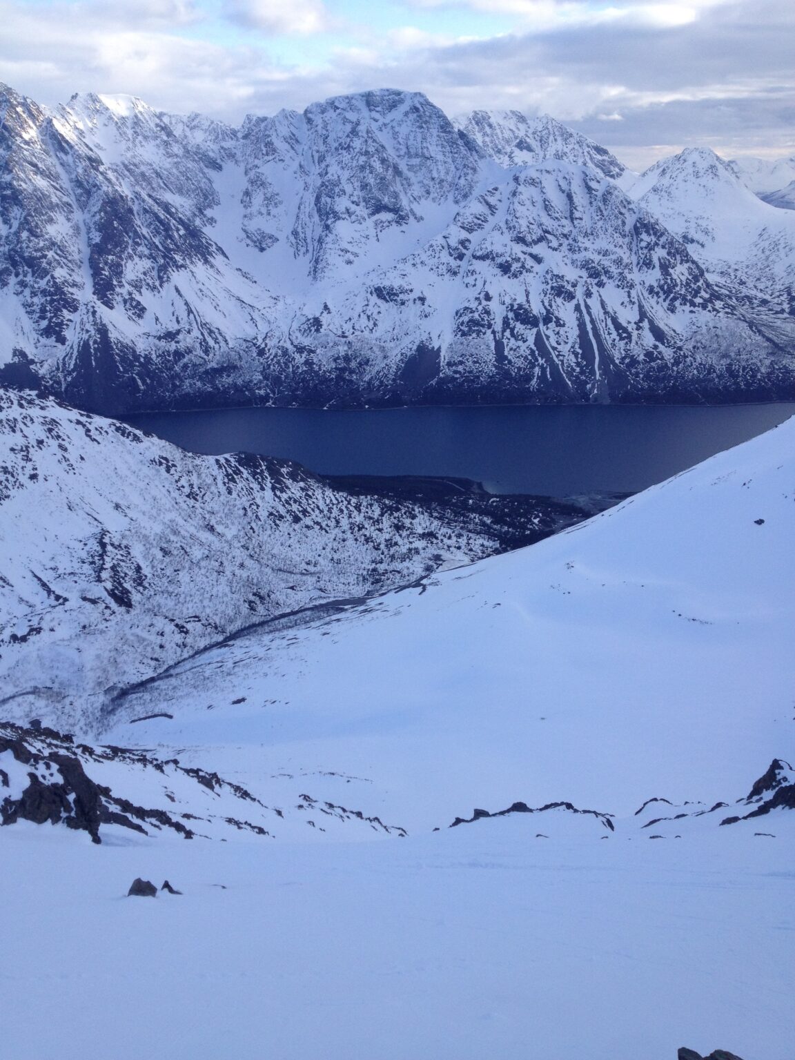 Looking down the South slope of Tverelvdalstindan in the Lyngen Alps of Norway