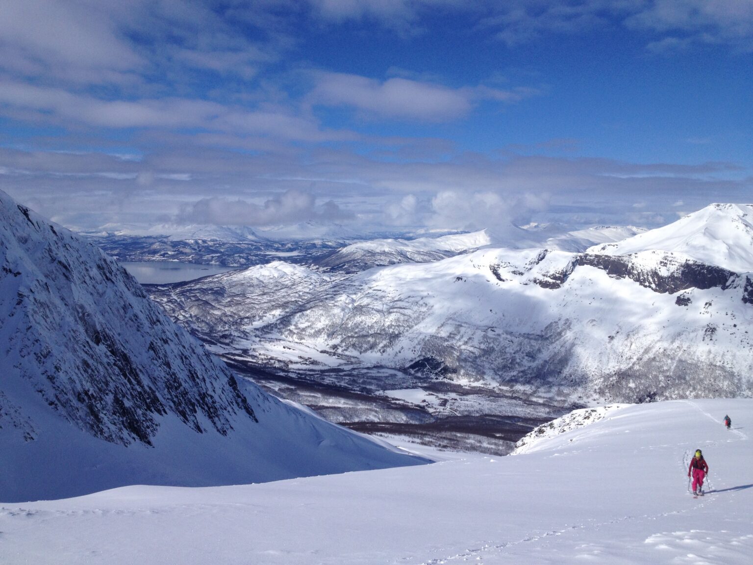 Heading up the upper slopes of Vardtinden in the Lyngen Alps