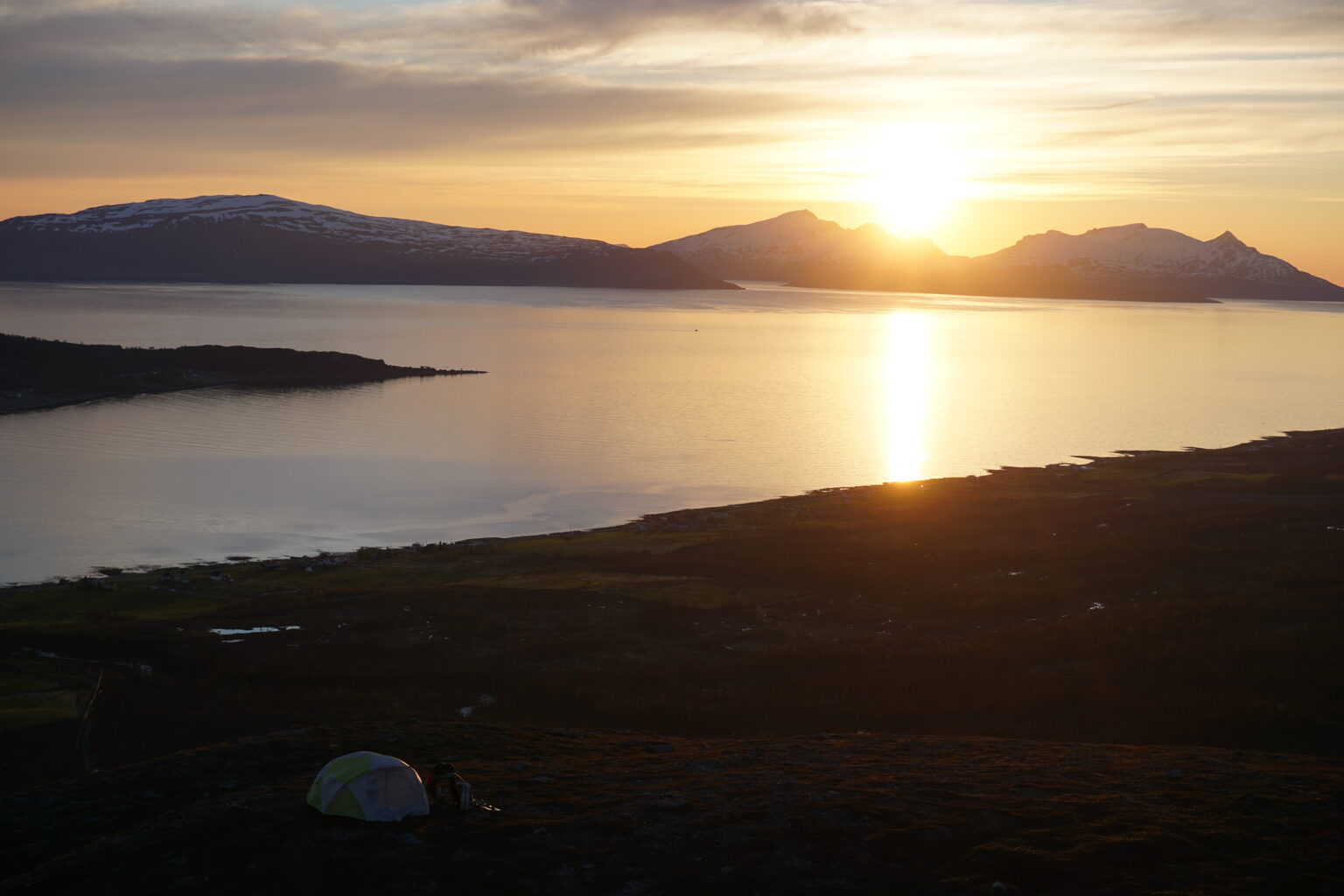 Hanging out at camp as the sun sets to the North