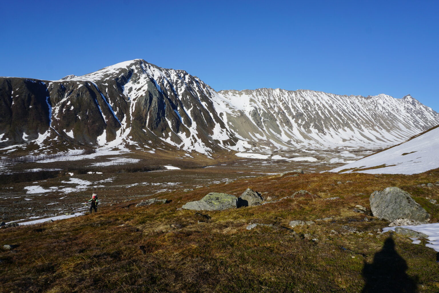 Looking at some awesome chutes in the Lyngen Alps of Norway