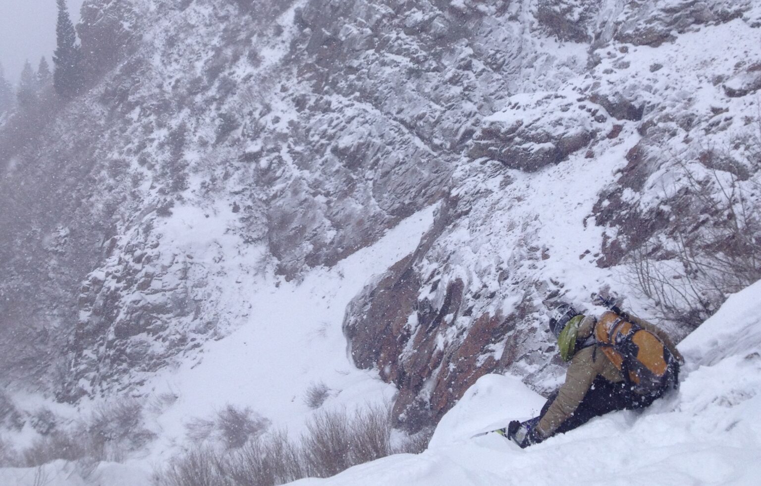 Getting ready to take off the board before down climbing the waterfall section of Argenta West Face