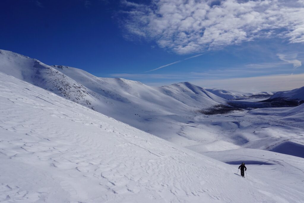 Ski touring up with the Kukisvumchorr Backcountry in the distance