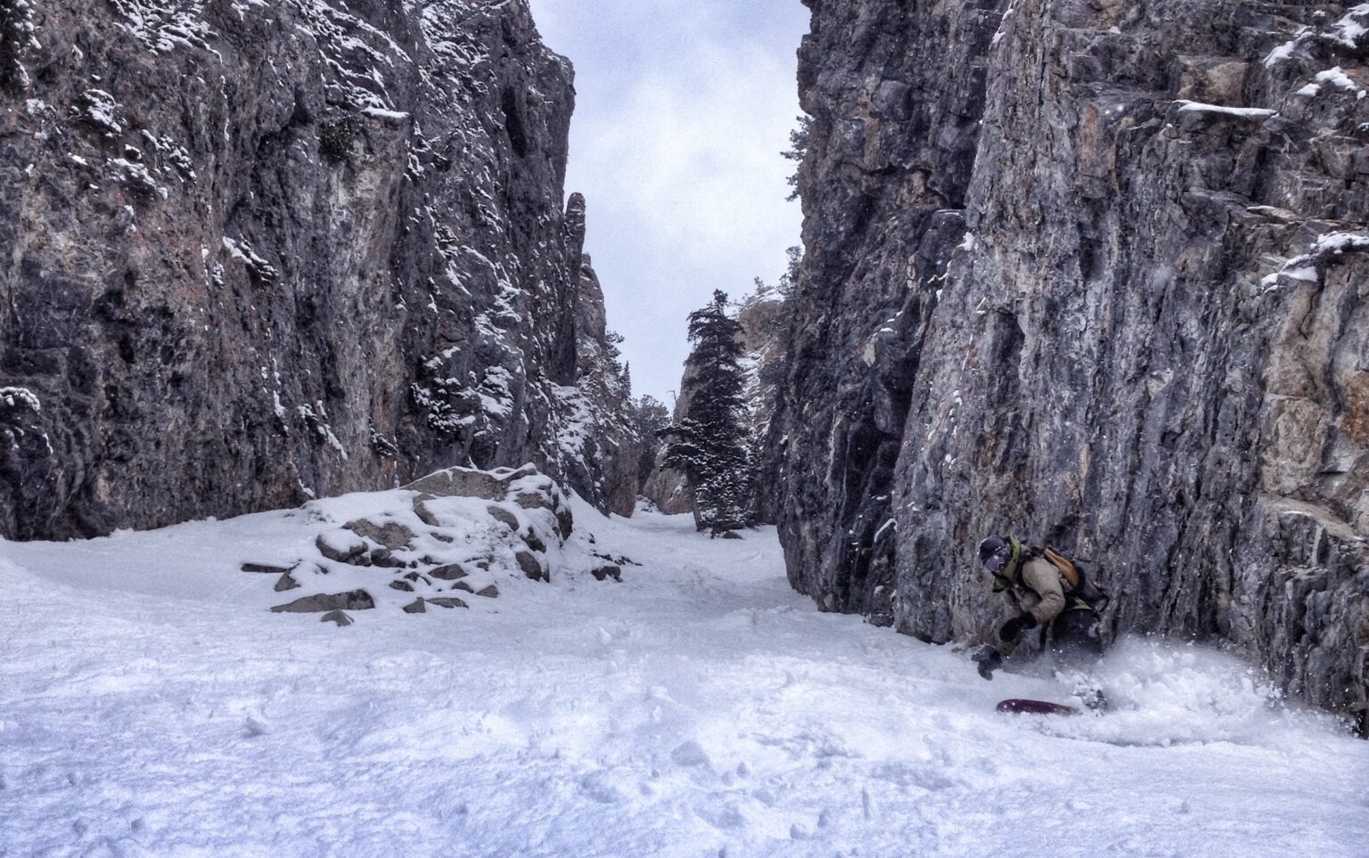 Looking back up Benson and Hedges as Bucky snowboards down