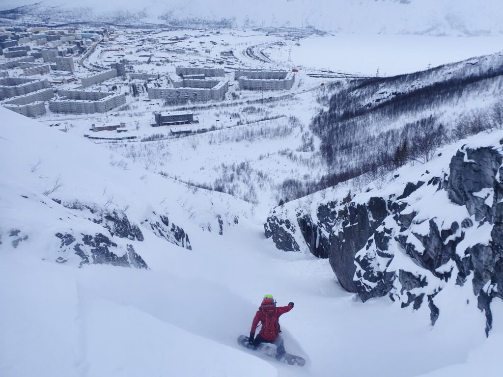 Snowboarding the backcountry of Big Wood ski resort in the Khibiny Mountains on Arctic Russia