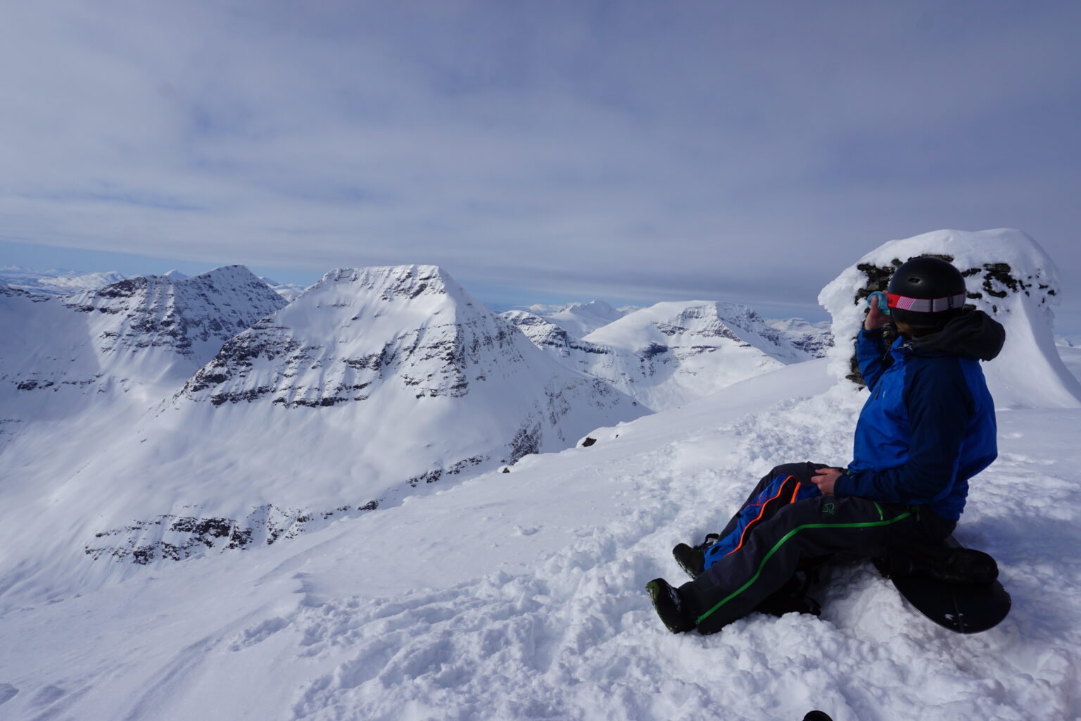 Enjoying the view from the summit before snowboarding Blåbærfjellet South face