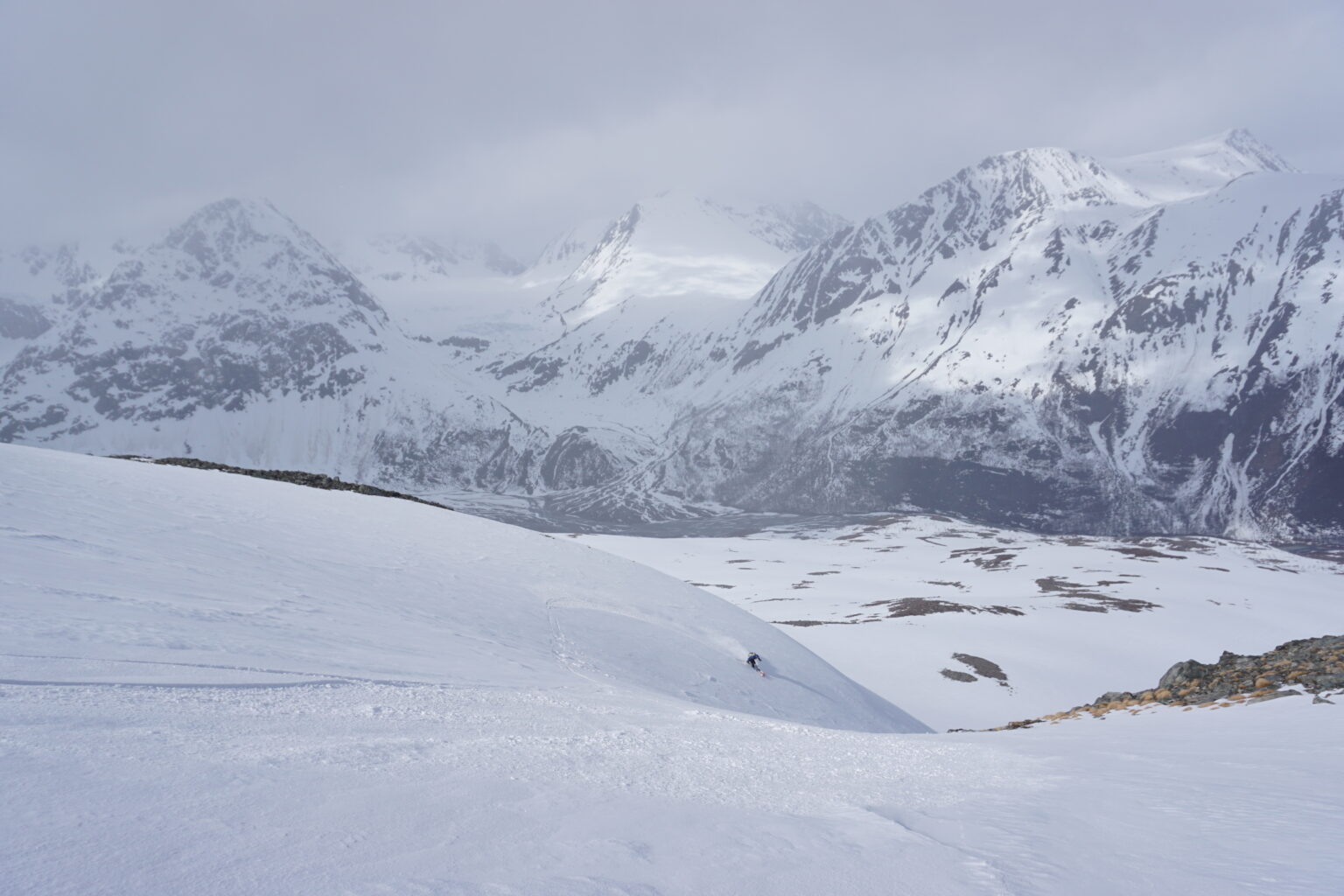 Making powder turns down the Northwest bowl of Daltinden in the Lyngen Alps of Norway