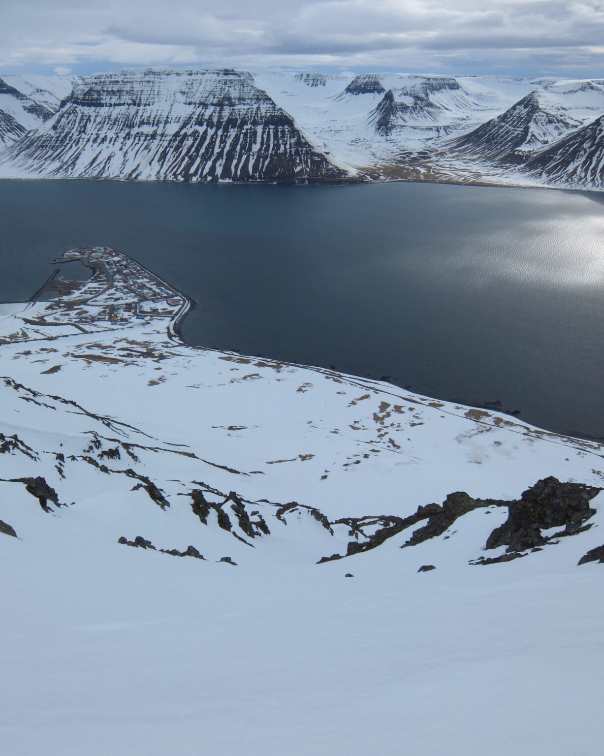 Looking down the South Couloir of Eyrarfjall with Flateyri in the distance