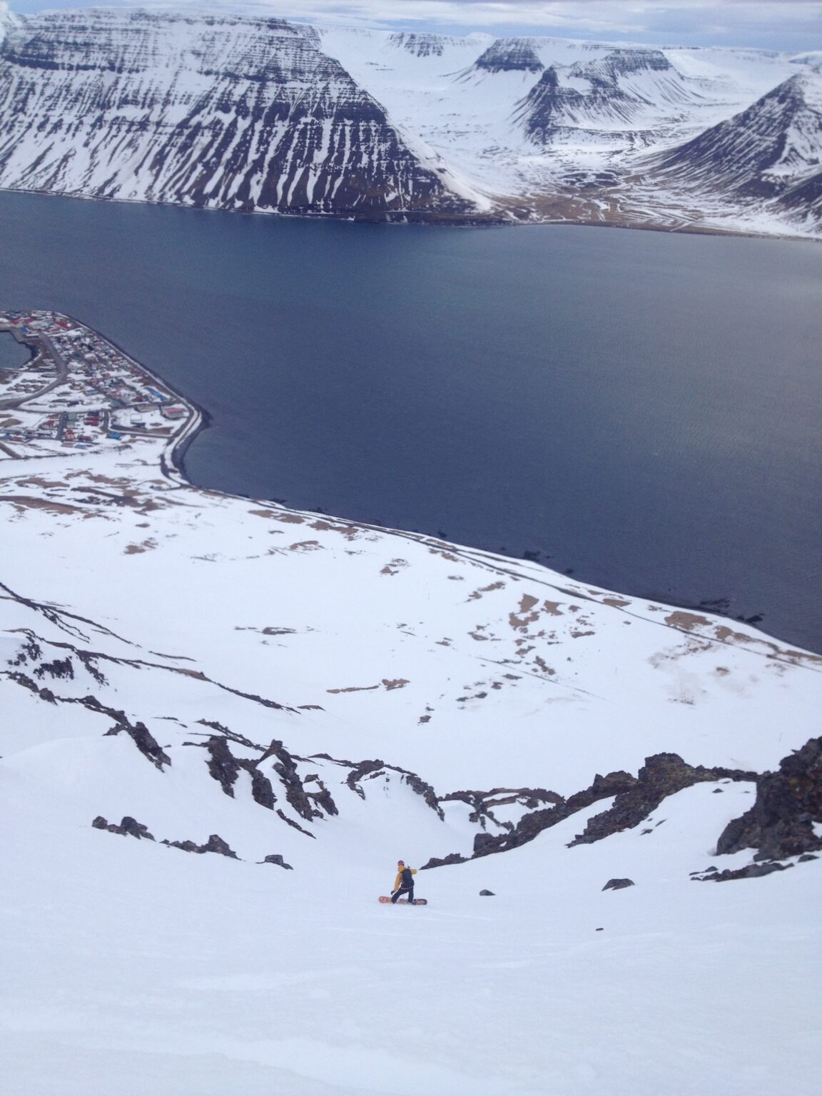 Snowboarding down the South Couloir of Eyrarfjall