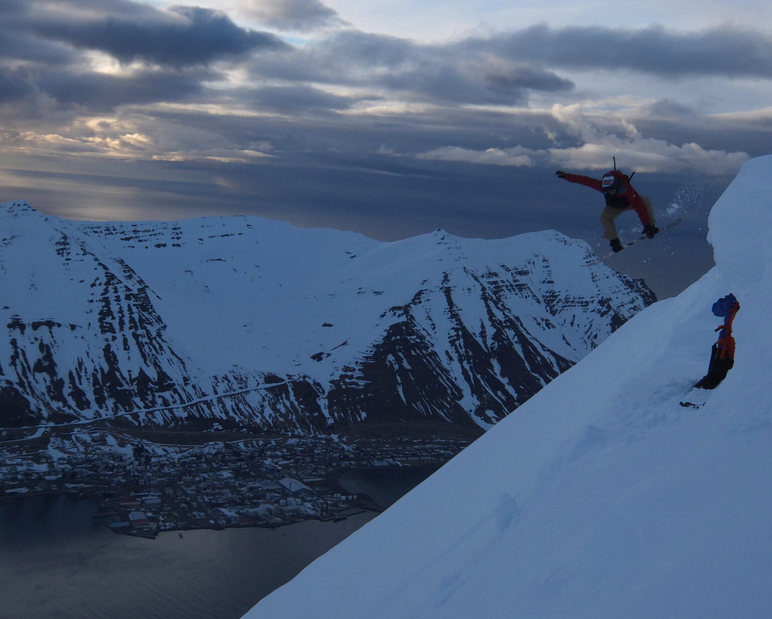 Having fun snowboarding off a cornice in Northern Iceland