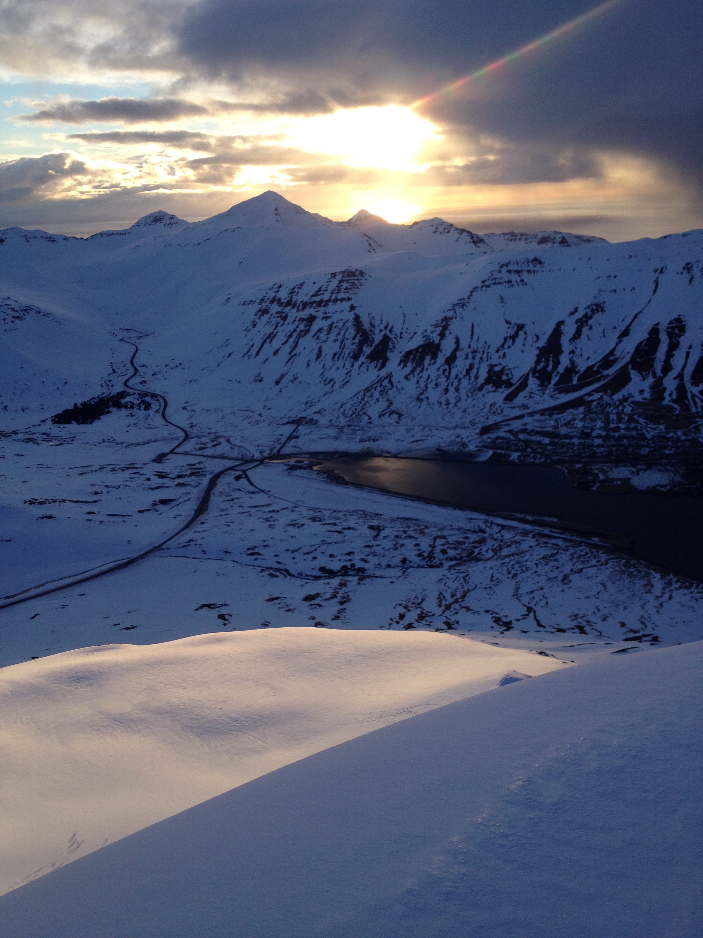 Waiting for the sun to arrive while ski touring