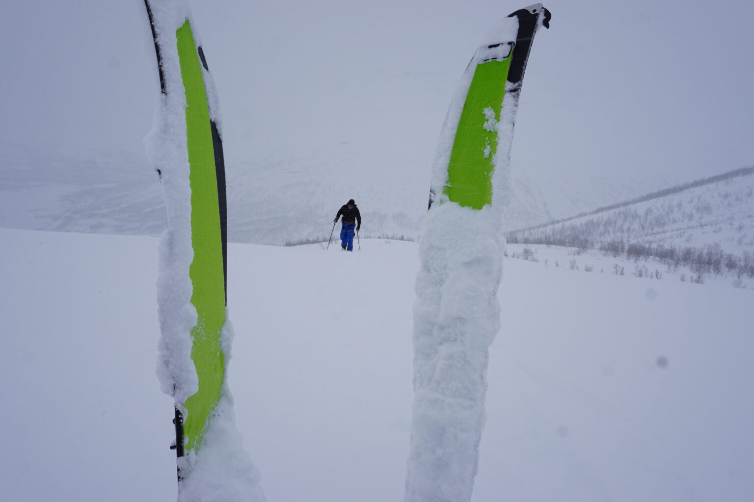 Snow sticking to the skins while ski touring in Northern Norway