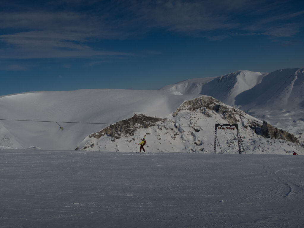 Heading up the upper T-bar at 25 km ski center with the Khibiny Mountains in the background