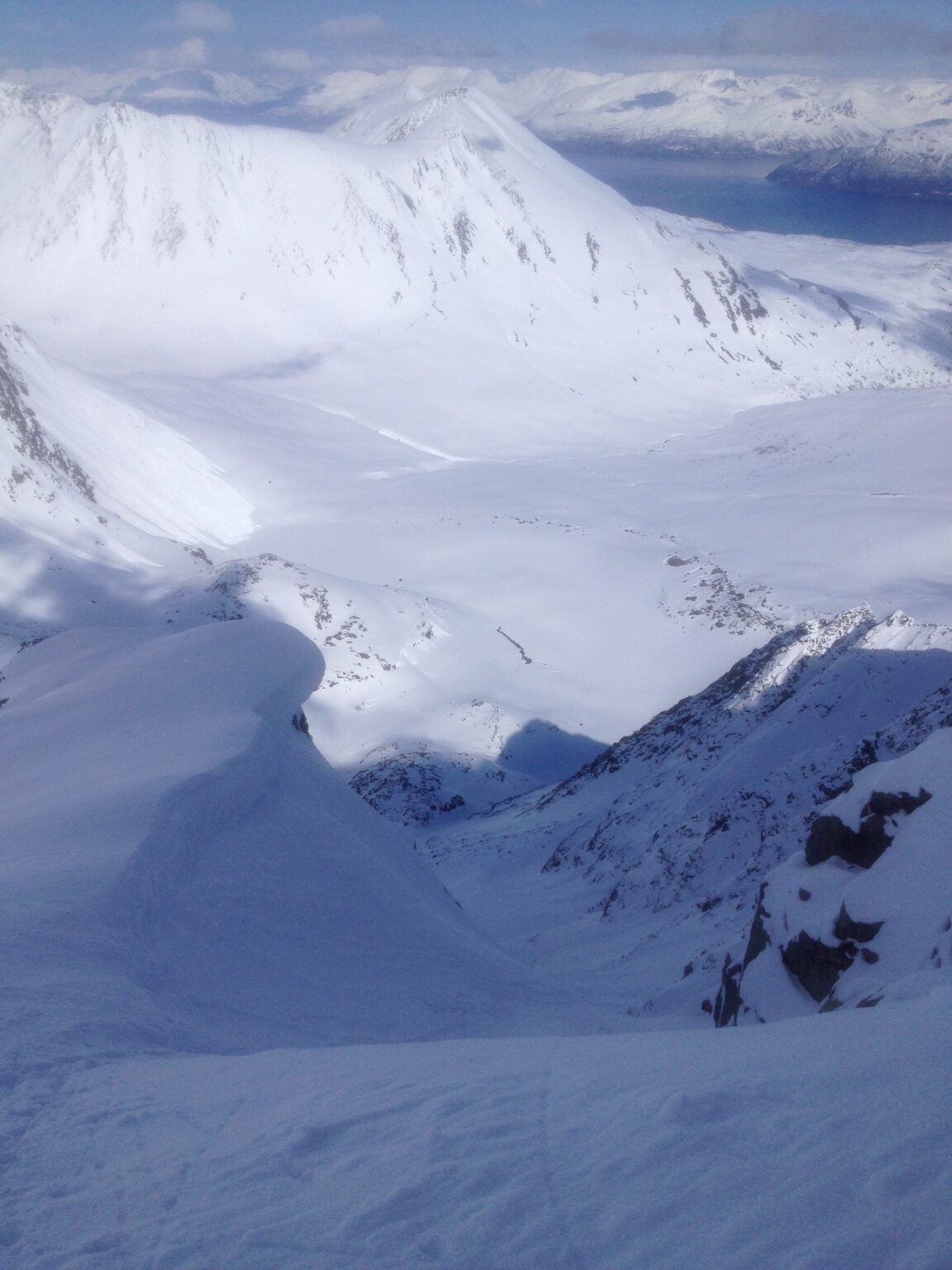 Looking down the north face of Bredalsfjellet in the Lyngen Alps of Norway