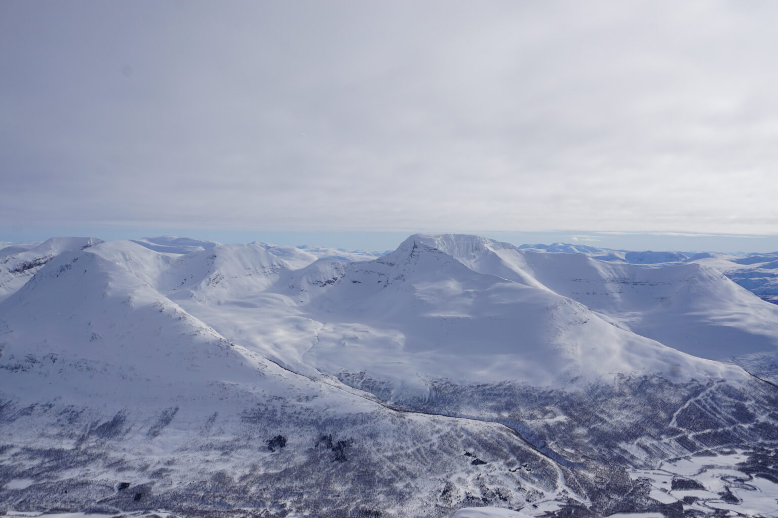 Looking at Melkefjellet and Istinden Ridge from the summit of Sjufjellet