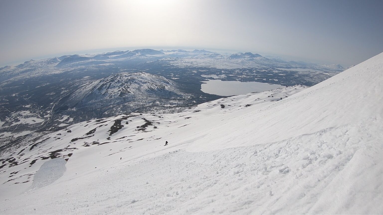 Snowboarding down the south face in corn