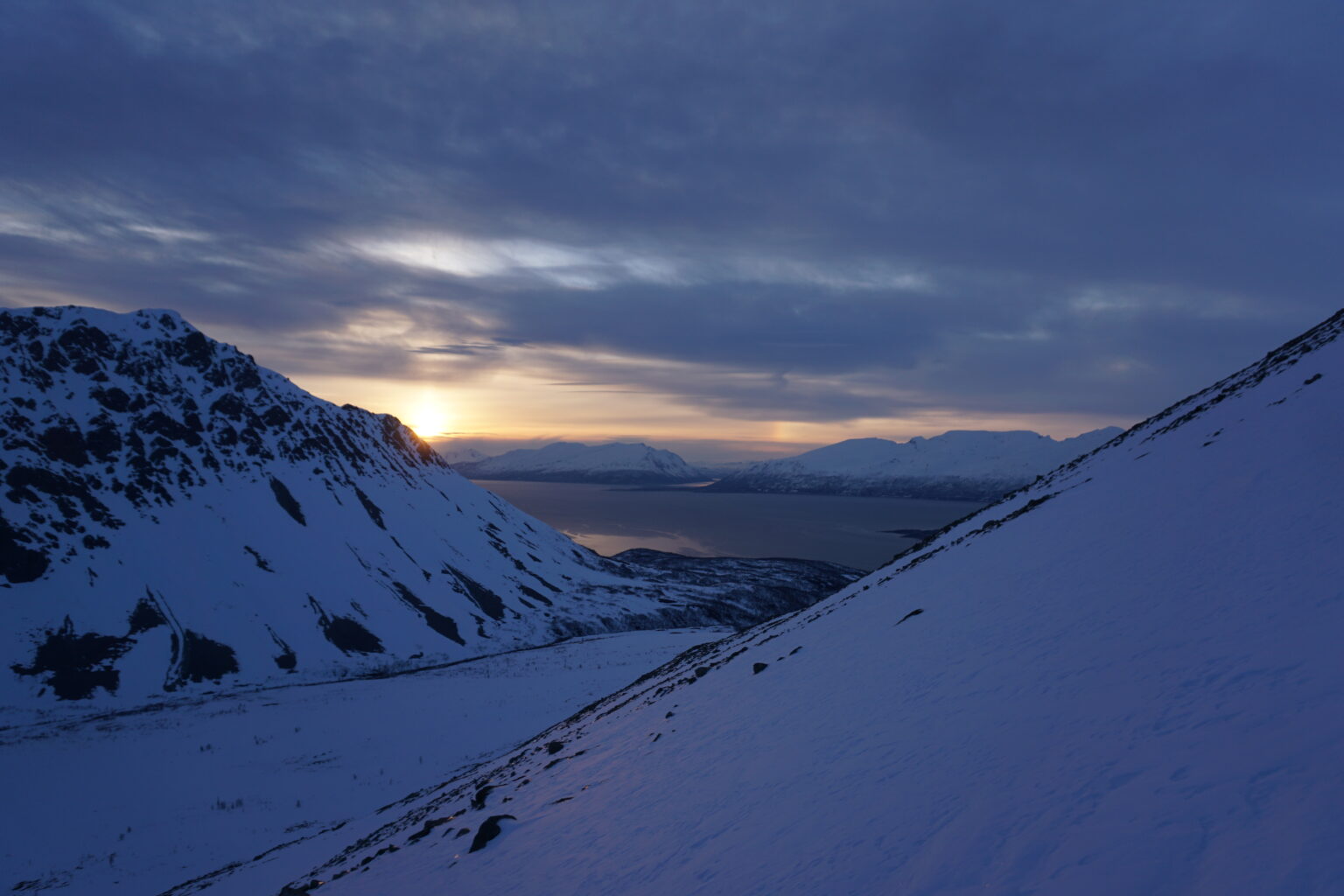 Watching the sun rise as we climbed Fastdaltinden on the Northern Loop