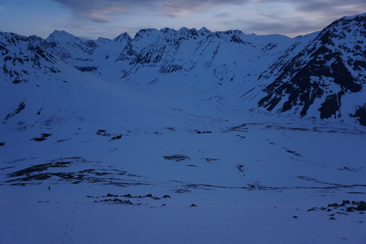 Hiking up Fastdaltinden at dusk during the Northern Loop