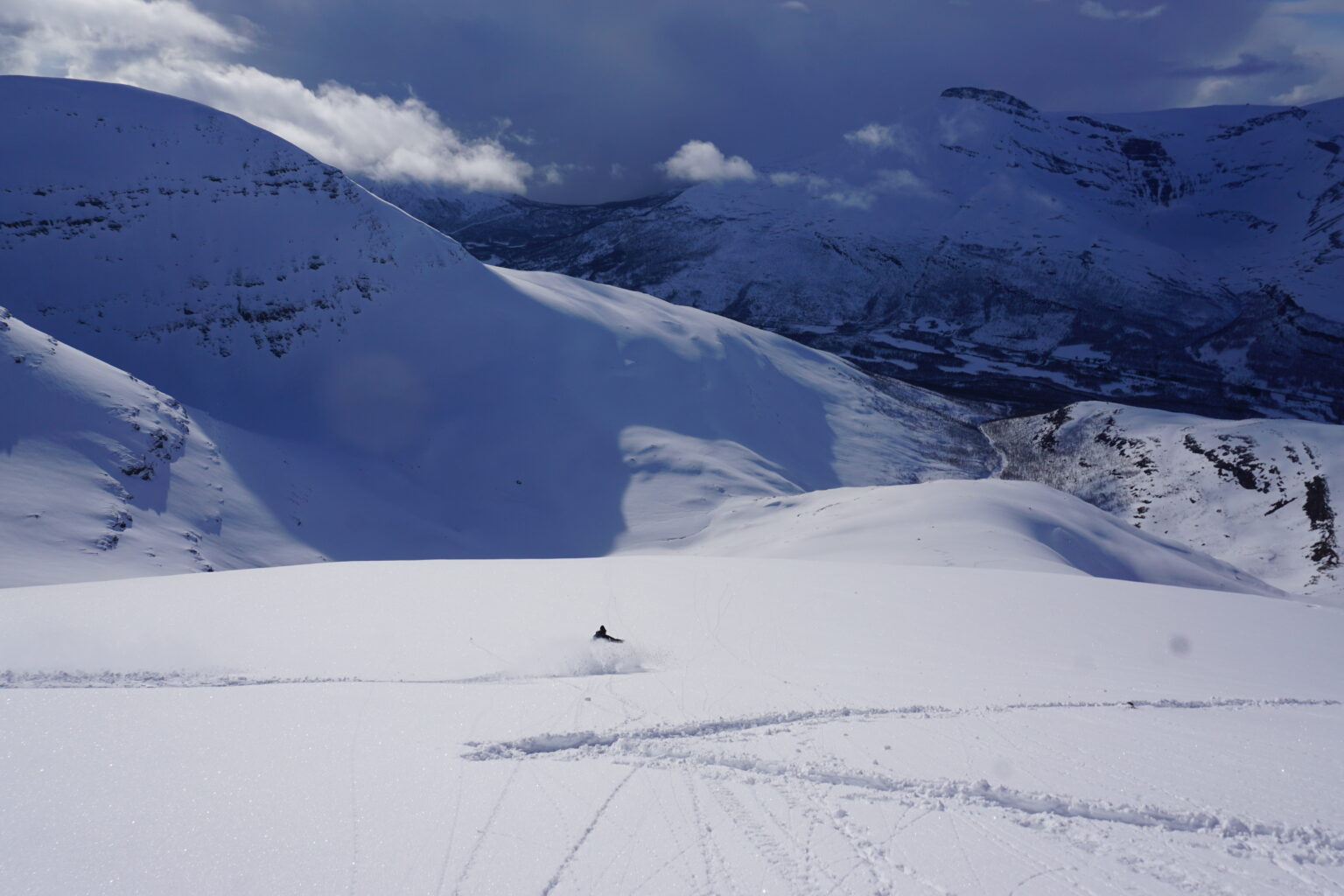 Looking down Midteraksia while laying in some powder tracks