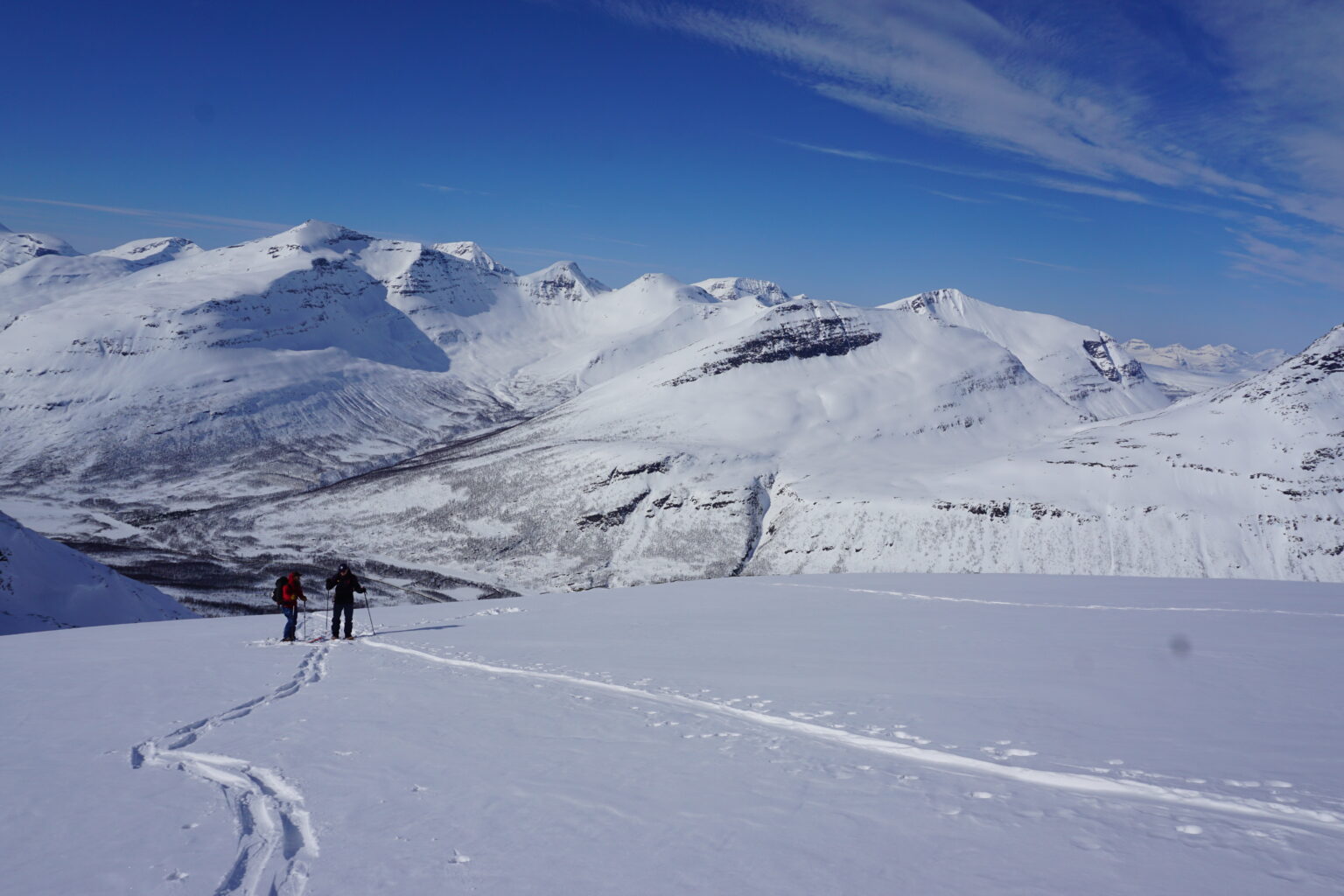 Ski touring up with the Tamokdalen Backcountry in the distance