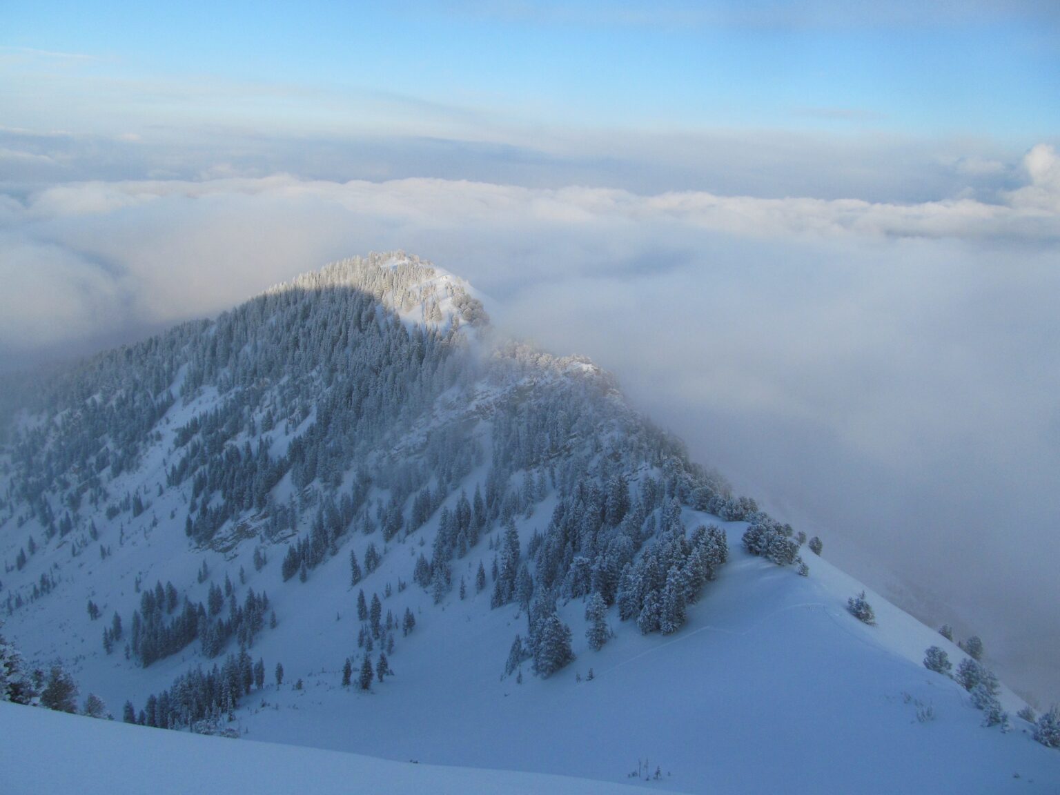 Looking at an inversion within the Wasatch Mountains while near the summit of Gobblers Knob