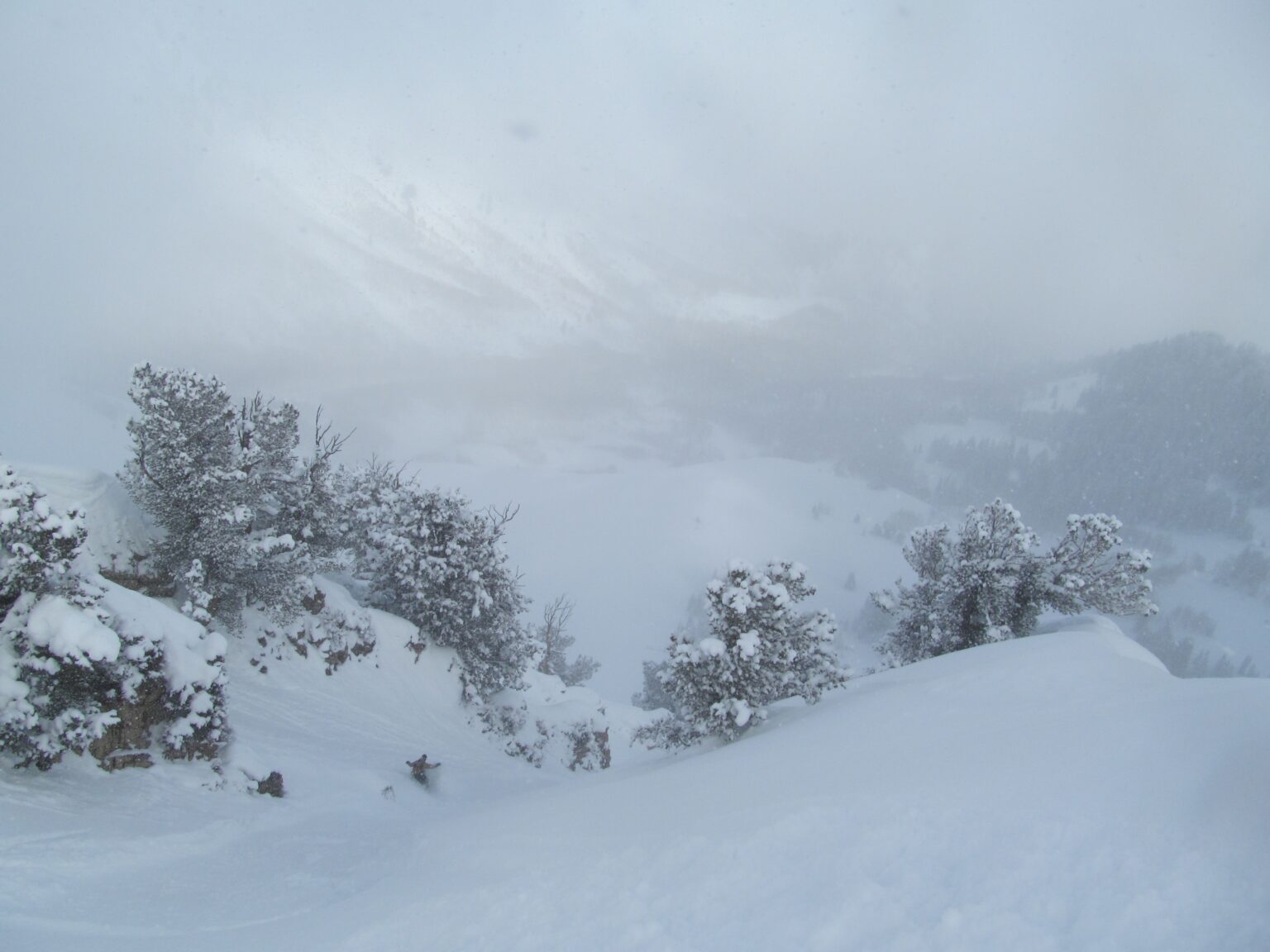 Heading down the upper East face of Mount Raymond