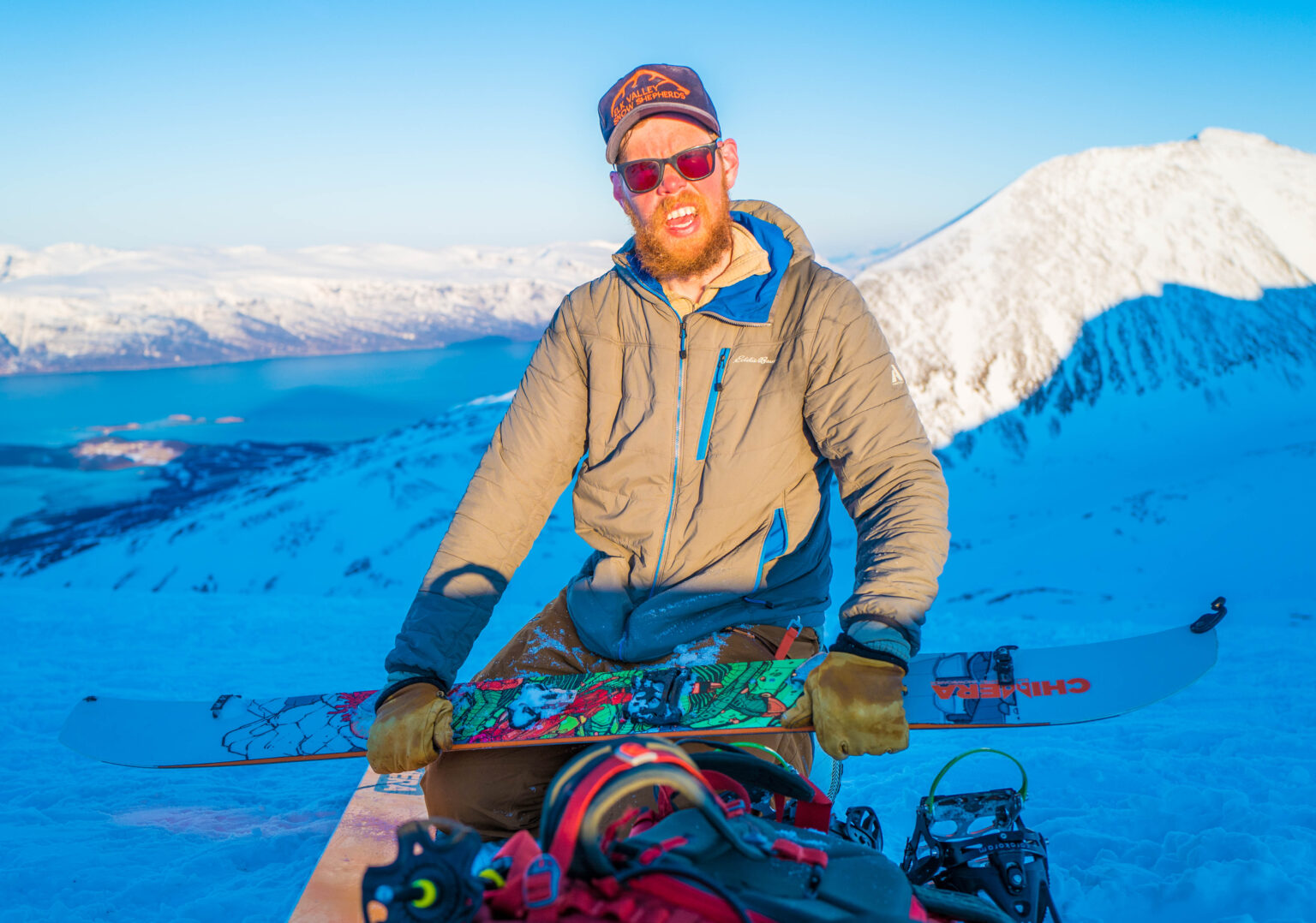 Transitioning over to snowboarding on top of the North Couloir of Rornestinden