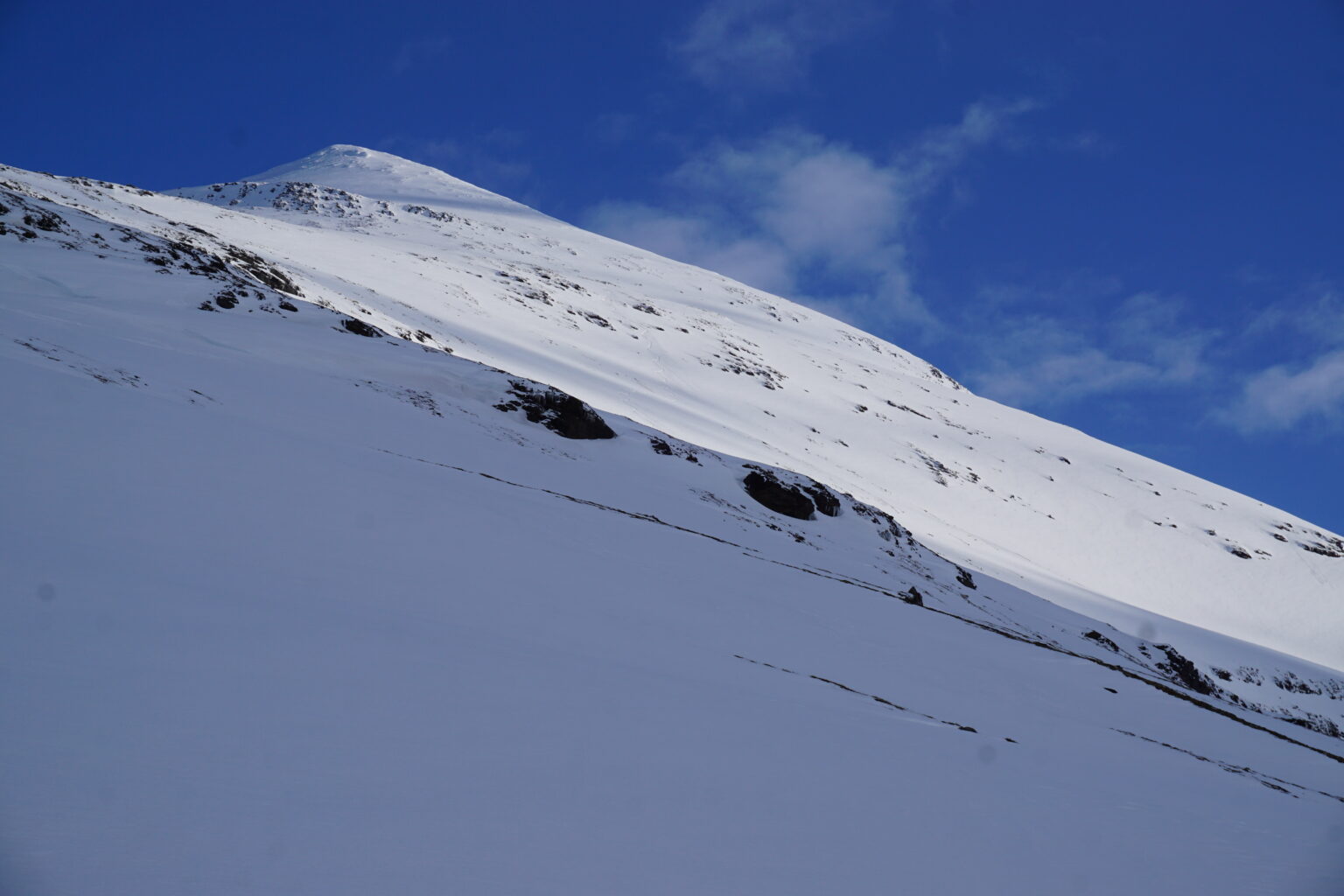 Looking back at my snowboard tracks on Lille Russetinden while on the Sjufjellet, Lille Russetinden and Blåbærfjellet Traverse