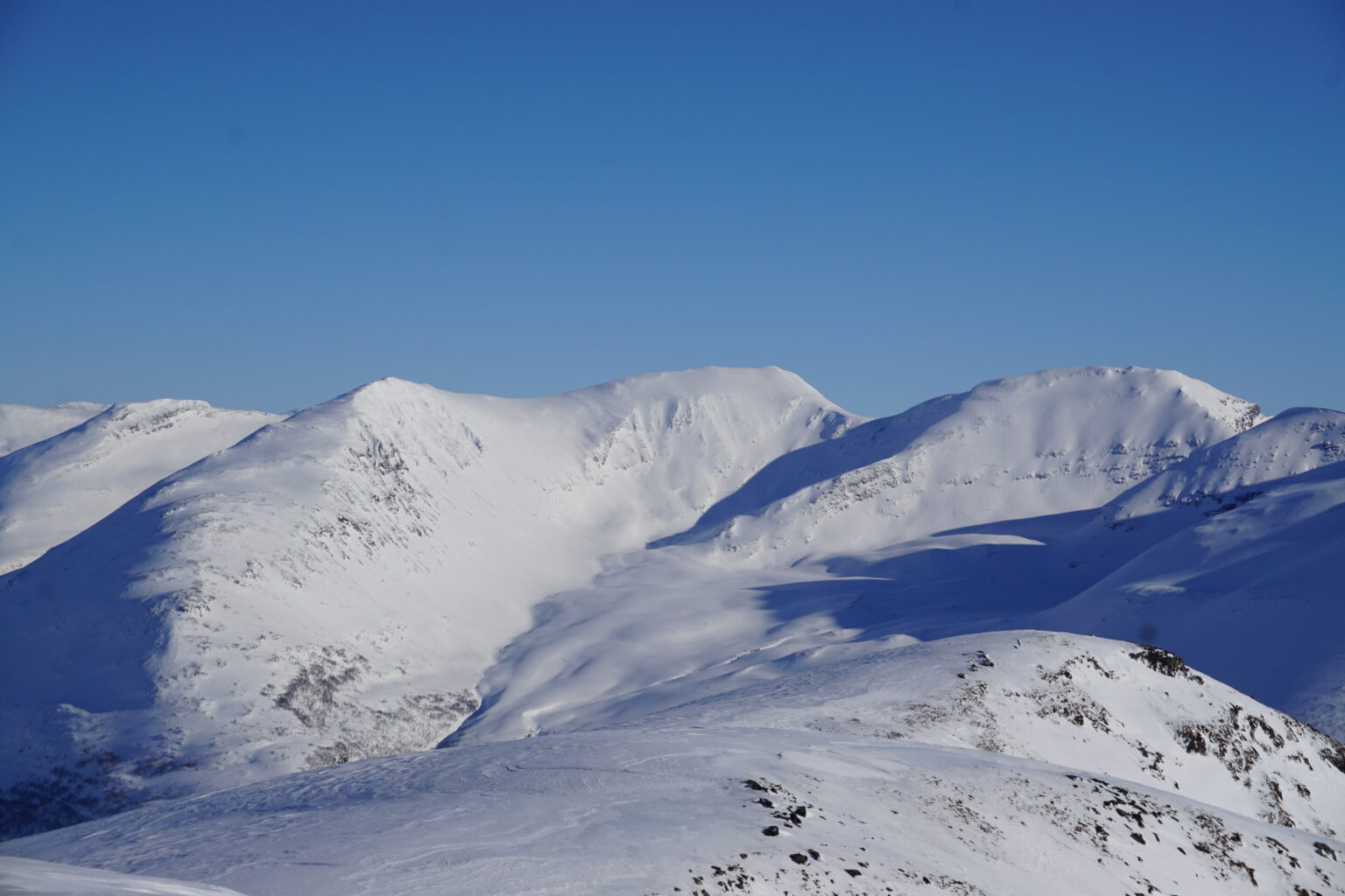 Looking towards the Tamok husset backcountry from the summit of Sjufjellet