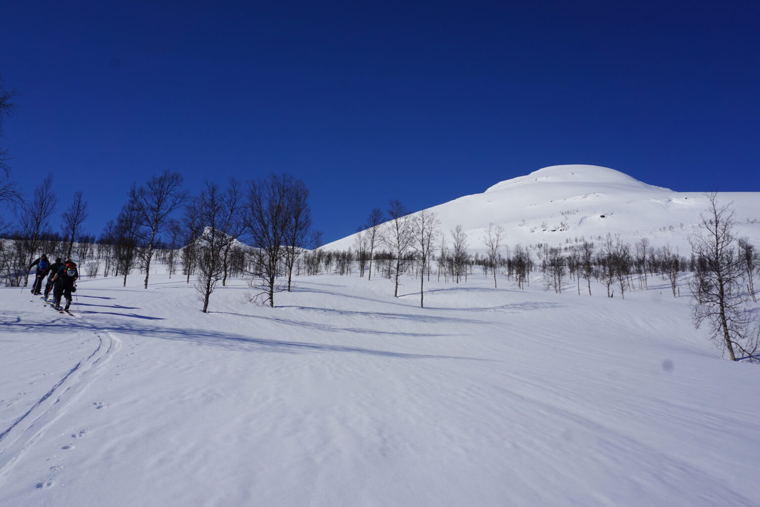 Skinning up the base of Sjufjellet