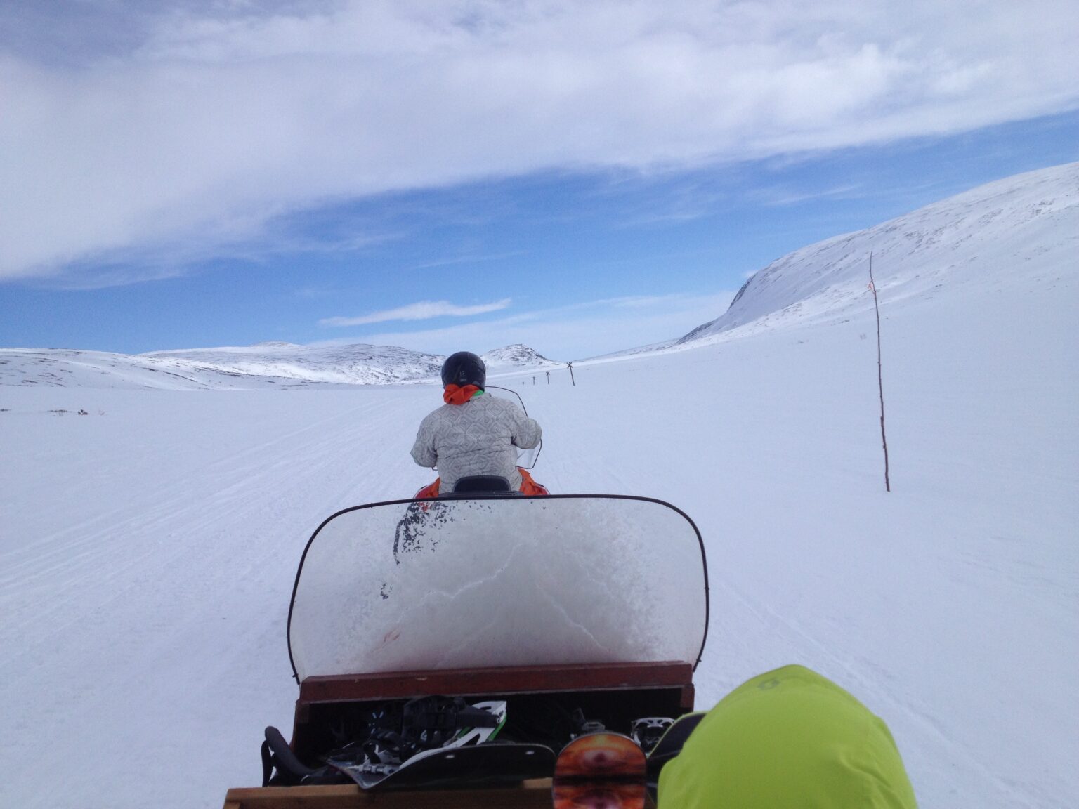 Using a snowmobile to access ski touring terrain