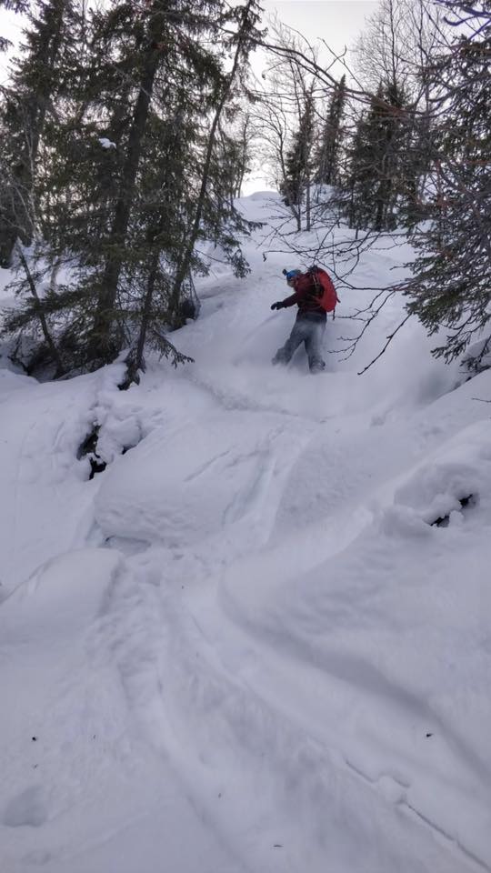 Snowboarding down in powder conditions