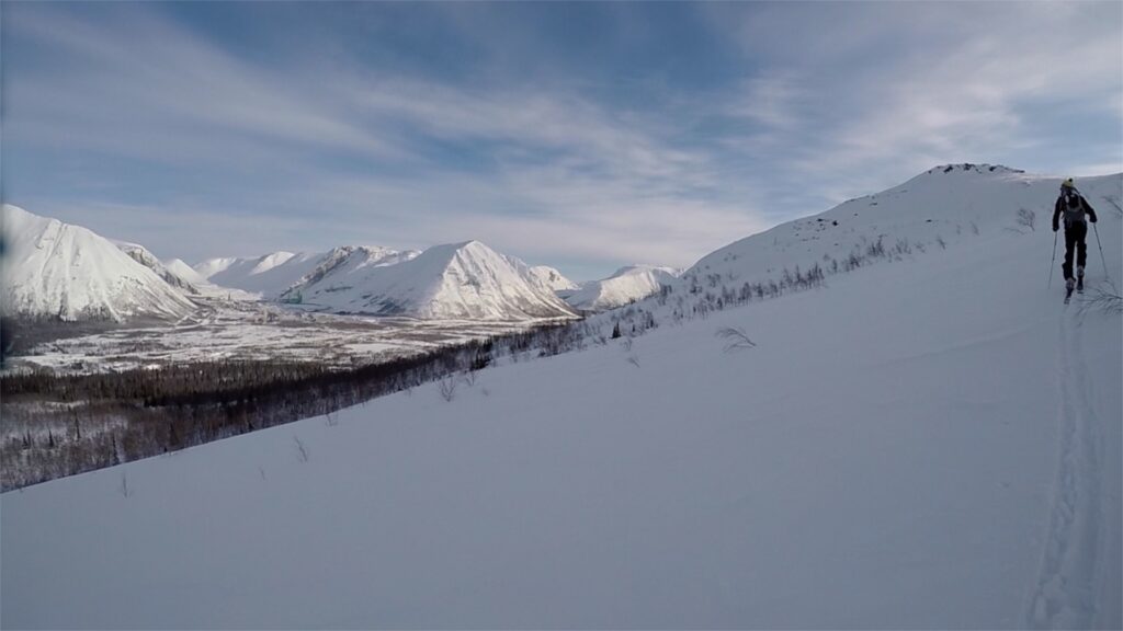 Skiing into he alpine with Kirovsk in the background