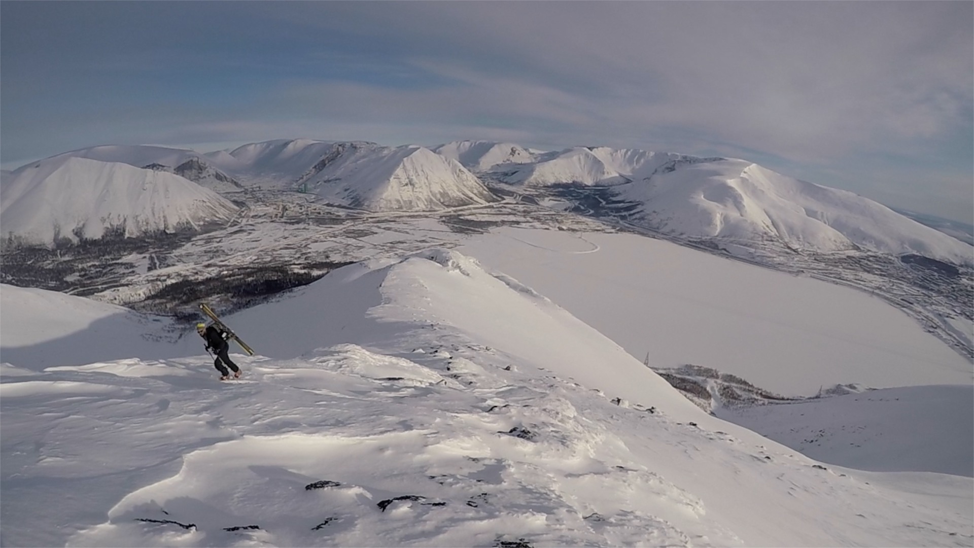 Arriving at the summit with Kirovsk in the background