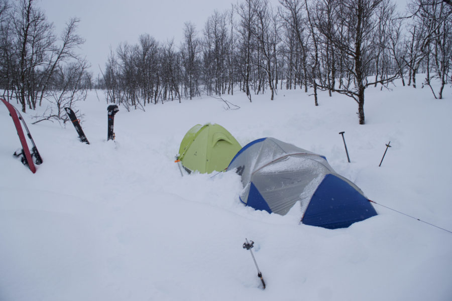 Putting up camp during a snow storm