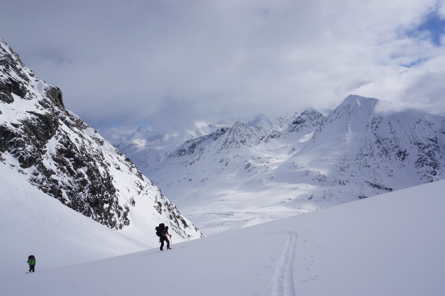 Ski touring up to Tvillingstinden while on the Lyngen Alps Traverse