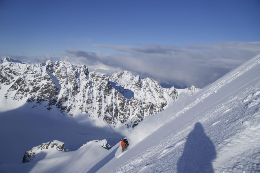 Snowboarding down Tvillingstinden during the Lyngen Alps Traverse