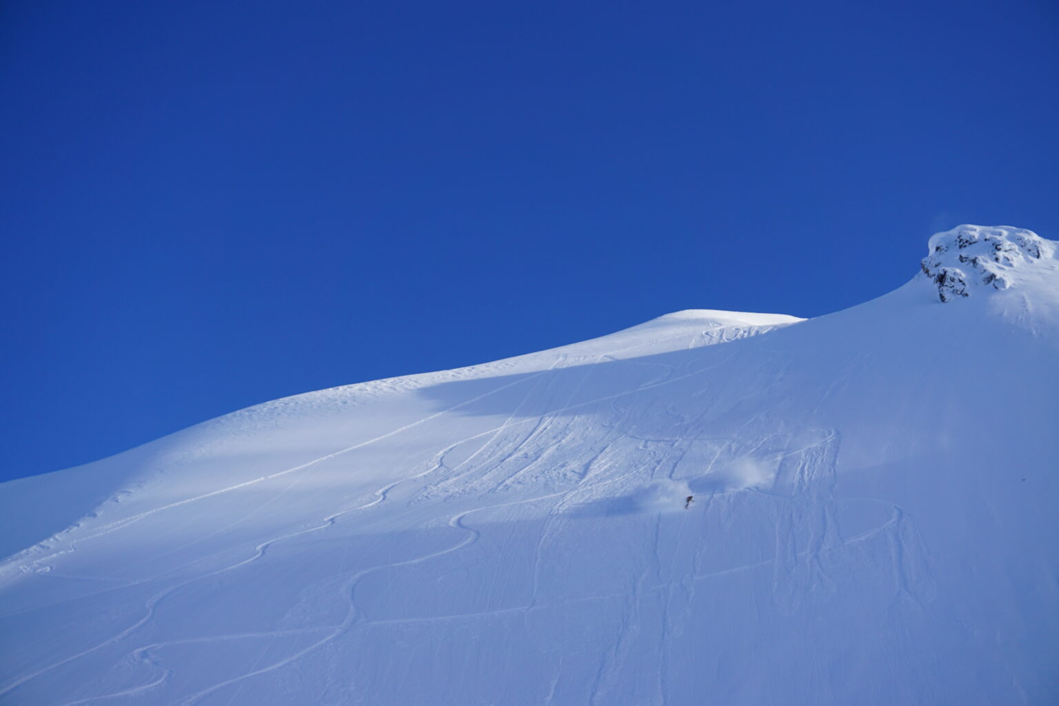 Leaving powder clouds with every turn