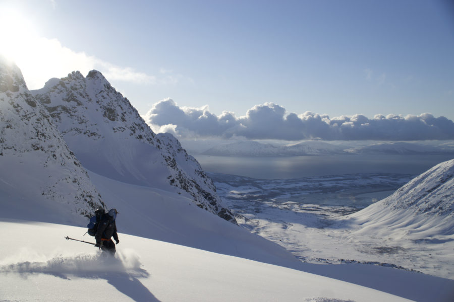 Snowboarding down the Lenangsbreen Glacier while on the Lyngen Alps Traverse