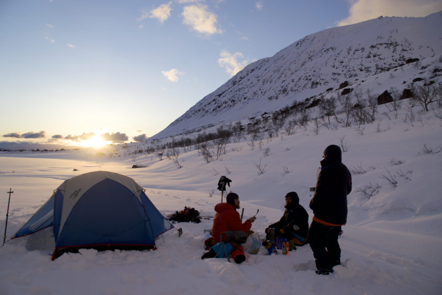 Watching the sun dip below the mountains while on the Lyngen Alps Traverse