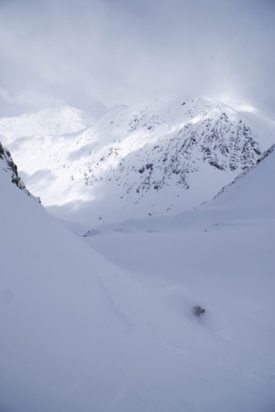 Riding down powder snow while on the Lyngen Alps Traverse