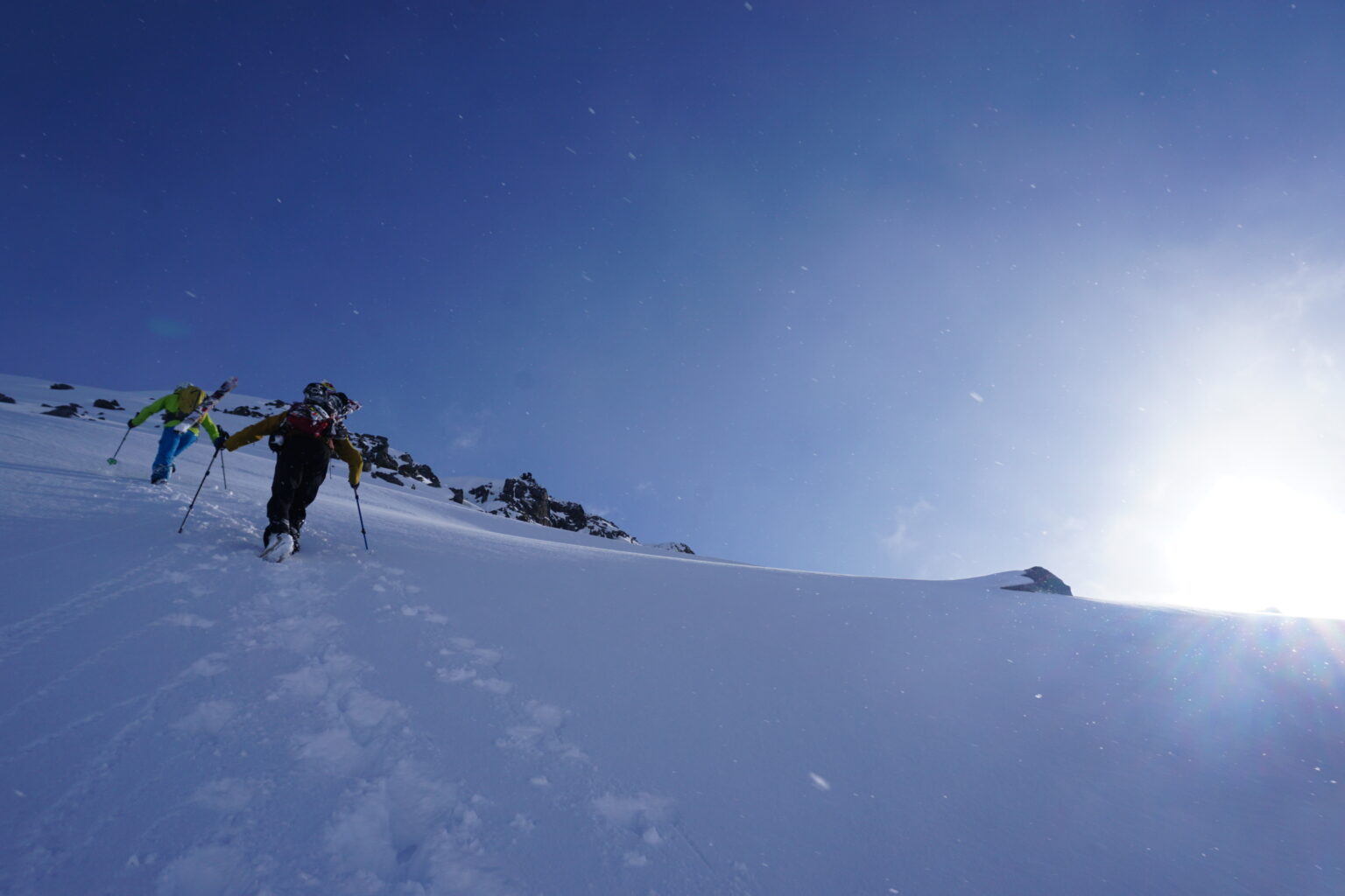 Hiking up to get our first powder turn of the Lyngen Alps Traverse