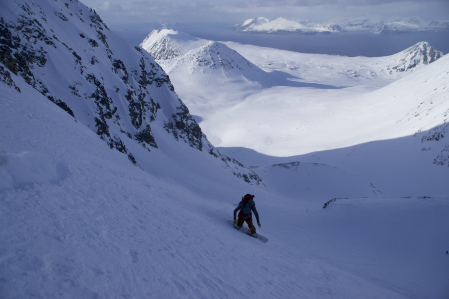 Snowboarding down the North bowl of Storgalten while on the Lyngen Alps Traverse