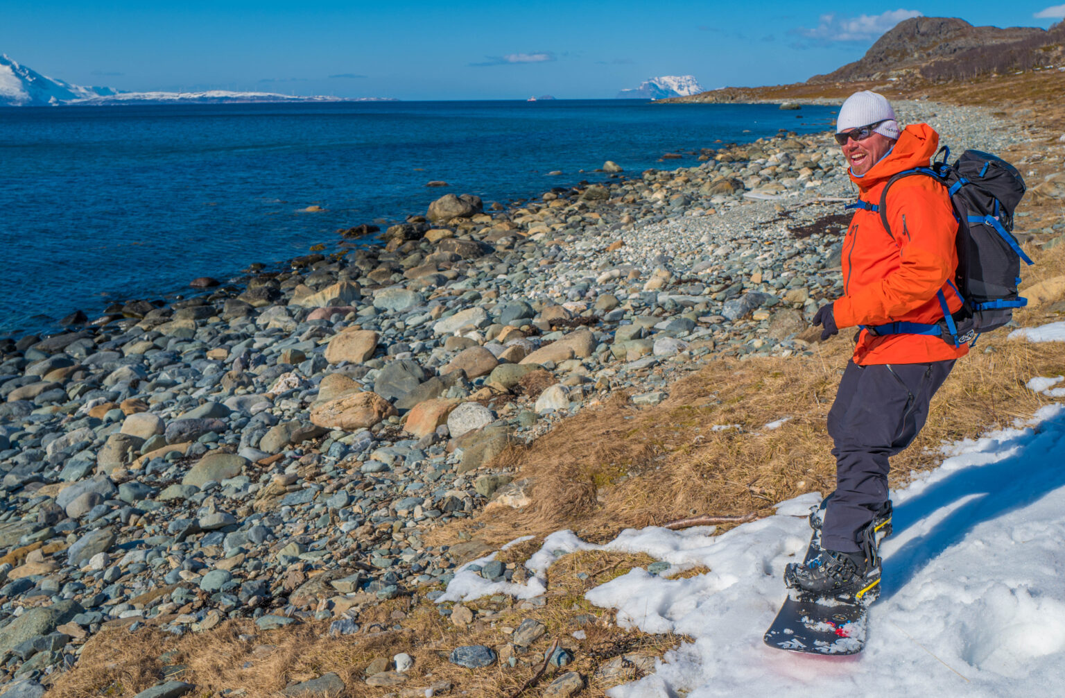 Snowboard turns all the way to the shore