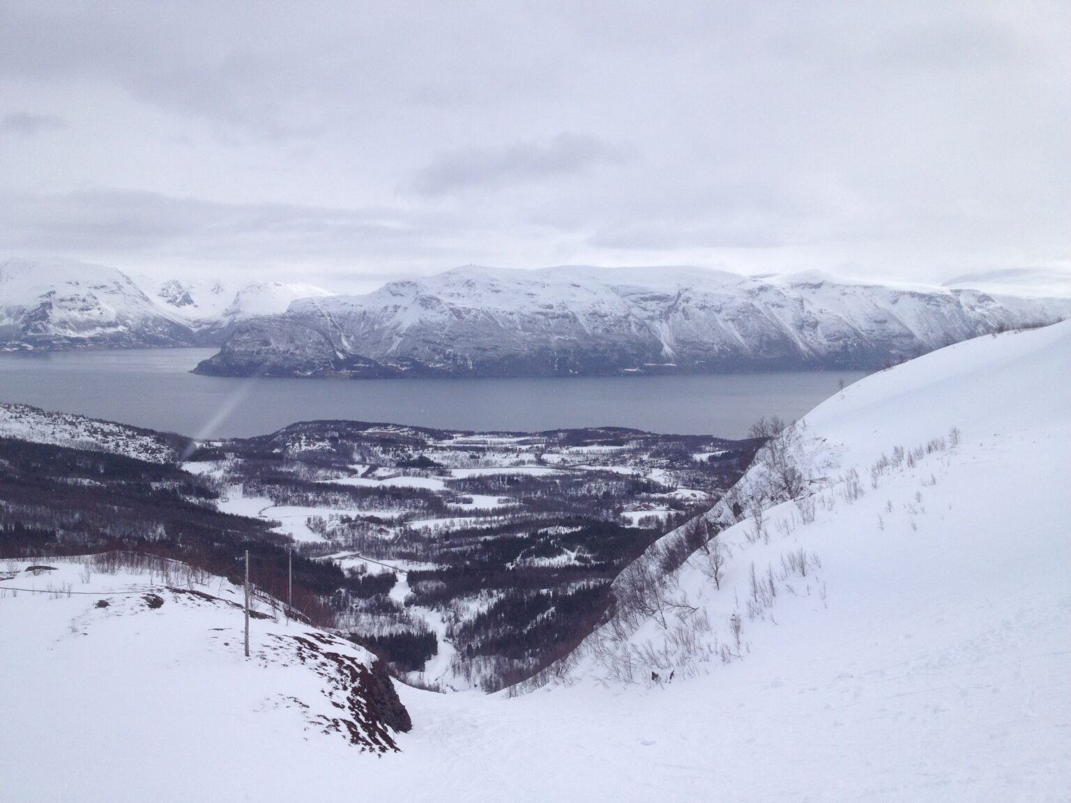 Ski touring up the Lyngen Alps in cloudy conditions