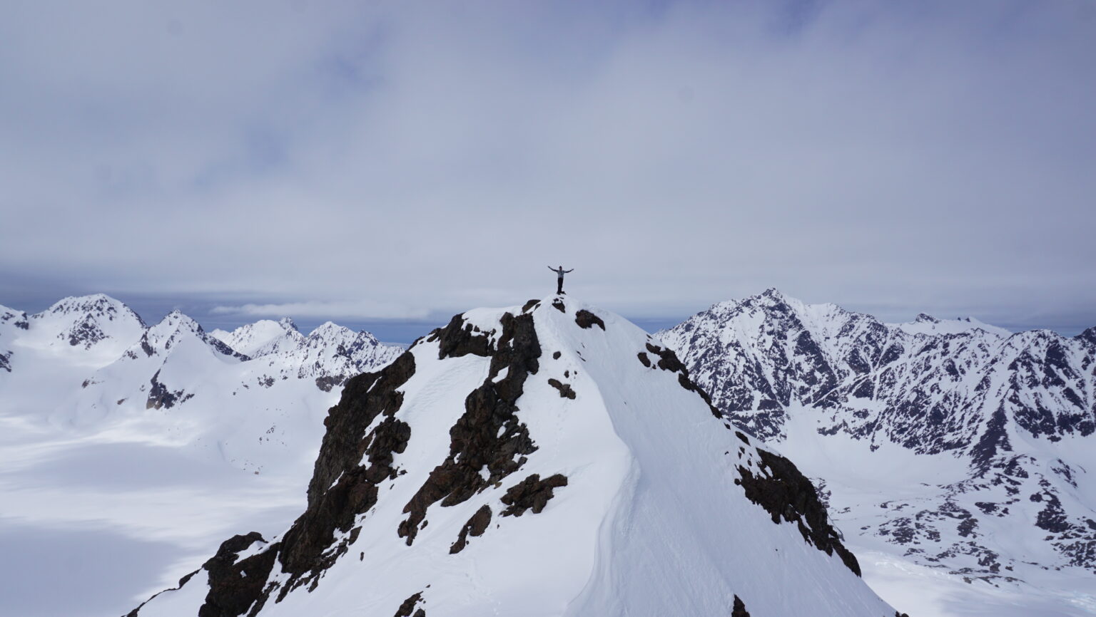 Celebrating being on the summit of Store Koppangstinden