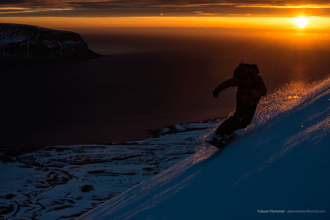 A epic snowboard shot while ski touring around Dýrafjörður in the Westfjords of Iceland